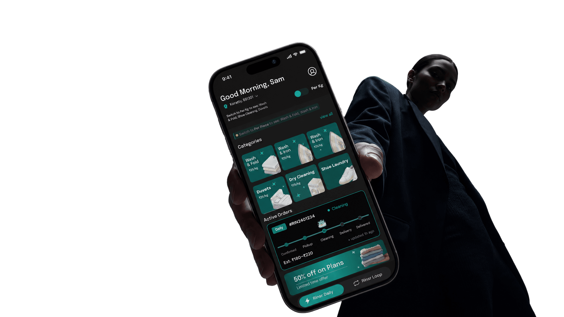 A person holding out a phone showing the RINSR home screen, with laundry categories and an active order